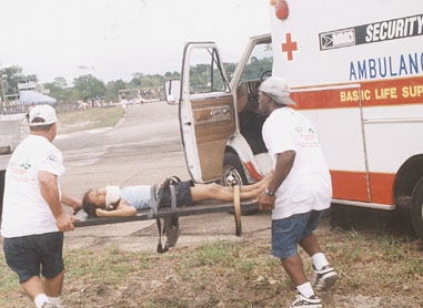 An injured child is taken to an ambulance.